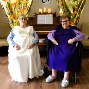 HRSN Senior Prom 2024 HRSN Senior Prom 2024, two lovely senior ladies posing in their prom outfits